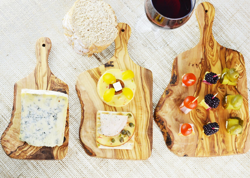 https://www.mrolivewoodwholesale.com/cdn/shop/products/wooden_olive_wood_set_of_3_paddle_boards_cheese_serving_800x.jpg?v=1557325104